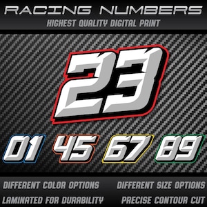 Può includere: Numeri da corsa in vari colori e dimensioni, con il numero 23 in evidenza. L'immagine include i numeri 01, 45, 67 e 89, ciascuno con un contorno di colore diverso. Il testo in basso recita "Laminated for Durability" e "Precise Contour Cut".