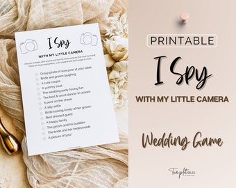 May include: Printable "I Spy with My Little Camera" wedding game with a list of items to find at the wedding reception. The game is printed on white paper with black text.
