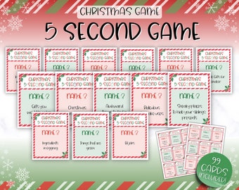 May include: A set of 99 Christmas-themed game cards with a red and green striped background. The cards feature the text "Christmas 5 Second Game" and various prompts for a game. The cards are designed with a festive Christmas theme.
