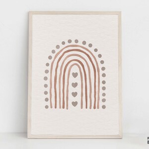 May include: A framed print of a watercolor rainbow with a brown and beige color scheme. The rainbow has a dotted border and small hearts in the center.