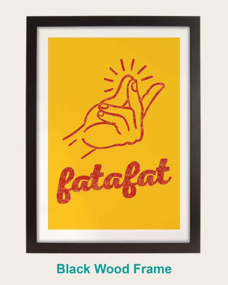 a hand gesture with the word "fatfat" written below it in a red font against a yellow background. The image is framed in a black wood frame.
