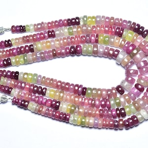 May include: A strand of multi-colored gemstone beads, featuring pink, red, yellow, and green hues. The beads are faceted and have a smooth, polished finish. The strand is approximately 18 inches long and is perfect for making jewelry.