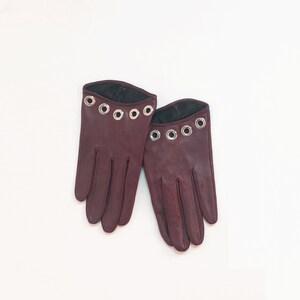 Short sexy leather gloves with silver eyelets detail cutout feminine seductive fitting soft lambskin lined silk made in Italy
