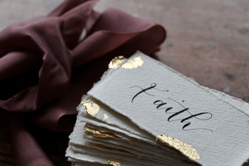 Recycled Cotton Rag Gold Leaf Wedding Place Name Cards with Elegant Hand Lettered Modern Calligraphy by Laneys Lettering Decadent Table Settings for Weddings