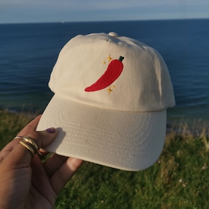 Natural Off-white hat with chilli and sparkles motif | baseball cap with embroidered detail | hat | chilli and sparkles | spicy cap dad hat