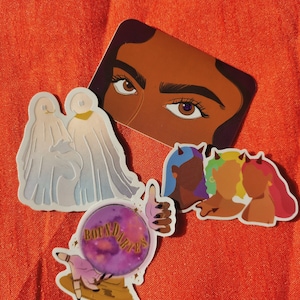 May include: A set of five stickers featuring a woman's eye, two ghosts, three women with horns, and a hand holding a crystal ball with the text "BOUNTY DARES".