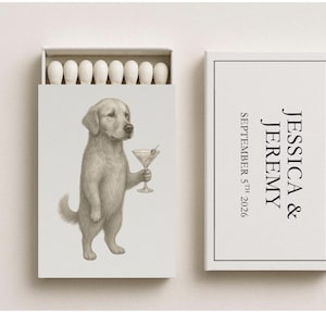 May include: A matchbox set with a whimsical illustration of a golden retriever holding a martini glass. The box on the right has the names "JESSICA & JEREMY" and the date "SEPTEMBER 5th 2026". The match heads are white.