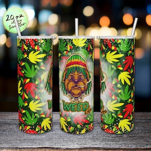 May include: A 20 ounce skinny tumbler with a green, yellow, and red marijuana leaf pattern. The tumbler features a cartoon image of a dog wearing a red, yellow, and green hat and smoking a joint. The text "Weed Life" is printed on the tumbler.