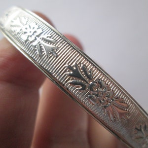 1960s Embossed Silver Tone Hinged Bangle Bracelet with Safety Chain