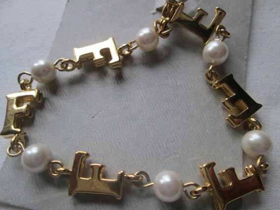 Marvella Pearl Gold Tone Initial F Bracelet with tag