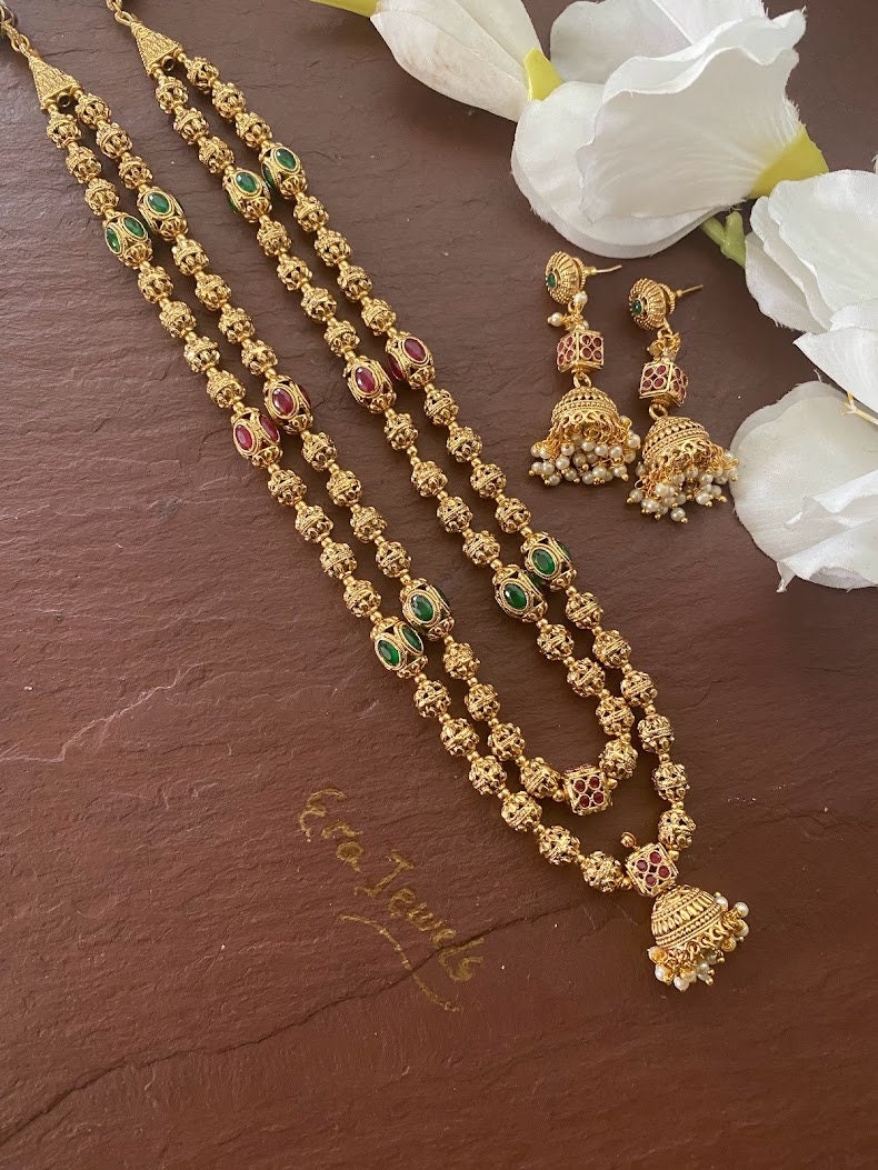 Gold chain with store peacock pendant