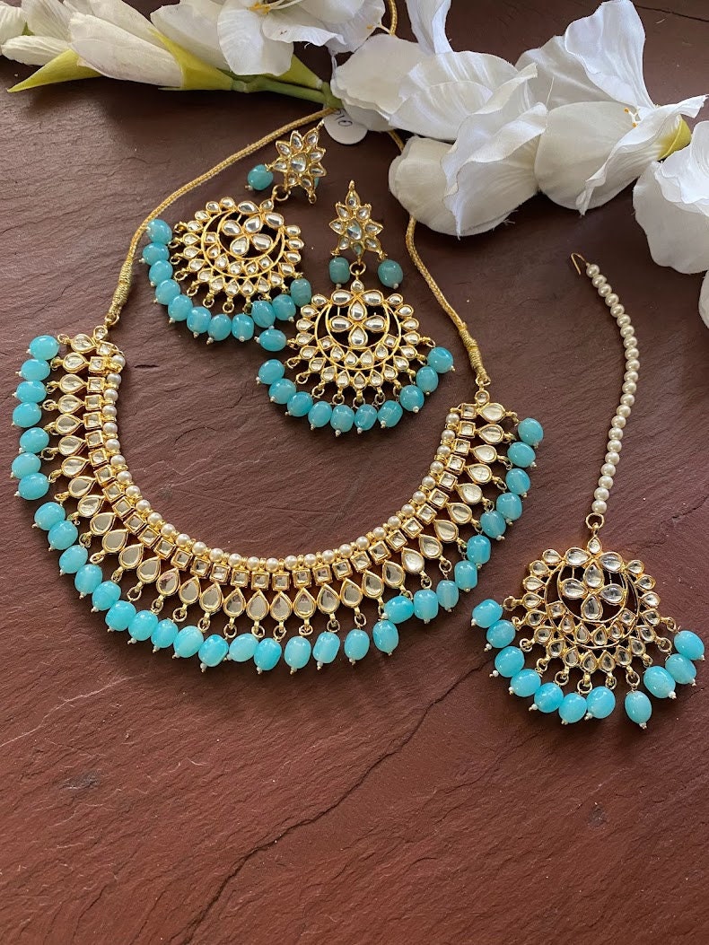 Shostopper By Sukkhi Kundan & Green Faux Beads Jewelry Set - Necklace, Earrings & Maangtikka