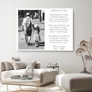 May include: Black and white photo of a father and daughter walking down a city street. The photo is accompanied by a poem about a father walking beside his daughter as she grows up. The poem reads: "Walk beside me. Daddy Walk alongside me. Daddy And hold my little hand. I have so many things to learn That I don't yet understand. Teach me things to keep me safe from dangers every day. Show me how to do my best at home, at school, at play. Every child needs a gentle hand To guide them as they grow So walk alongside me. daddy We have a long way to go I Love you. Daddy Jessica - 2020"
