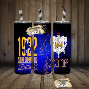 May include: Three stainless steel tumblers with blue and gold designs. The tumblers feature the text "Sigma Gamma Rho", "1922", "Founded 1922", and "ΣΓΡ".