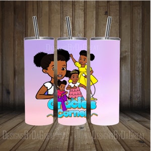 May include: A purple and pink stainless steel tumbler with a straw. The tumbler features a cartoon image of four girls with the text "Gracie's Corner".