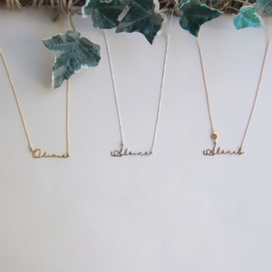 May include: Three delicate necklaces with the name "Alana" written in cursive script. The necklaces are on a white background and are made of gold, silver, and rose gold.