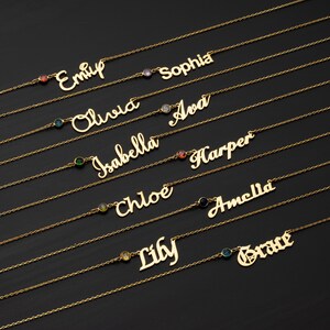 a collection of personalized name necklaces with gemstones, arranged in rows on a dark background.