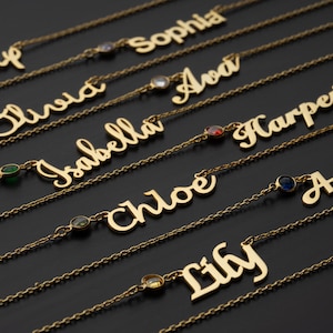 a collection of gold-colored personalized name necklaces with gemstones. The necklaces have names engraved on them, such as "Sophia", "Oliver", "Ava", "Harper", "Isabella", " Chloe", "Lilly", and "Amanda". The necklaces are arranged in rows, showcasing their unique designs and the names on them.