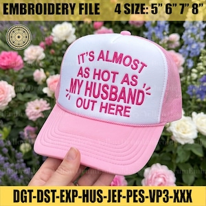 May include: A pink and white trucker hat with the text "IT'S ALMOST AS HOT AS MY HUSBAND OUT HERE" in pink. The hat has a mesh back and a curved brim. The embroidery file sizes are 12.7cm, 15.2cm, 17.8cm, and 20.3cm.