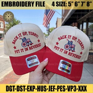 Puede incluir: Dos gorras de béisbol color crema y rojo con texto bordado en rojo que dice BACK IT UP, TERRY! PUT IT IN REVERSE! y un gráfico de una silla de ruedas con el patrón de la bandera estadounidense. Cada gorra tiene una pegatina Otto Classic Fit.