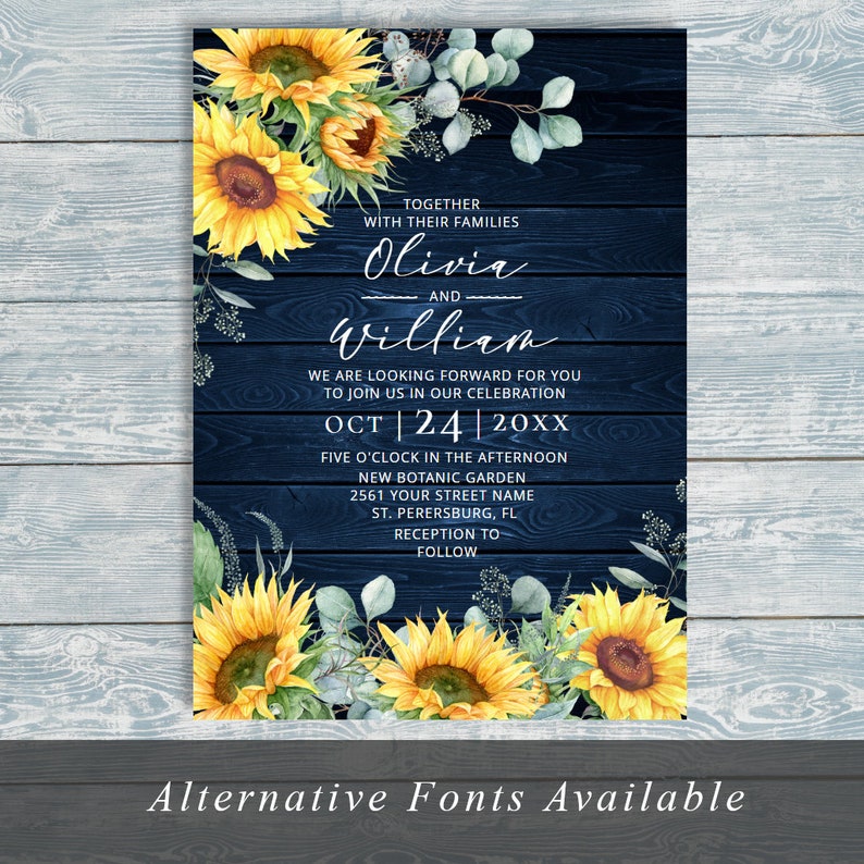 May include: A wedding invitation with a navy blue wood grain background, adorned with watercolor sunflowers and greenery. The invitation includes the names Olivia and William, event details, and the text "Alternative Fonts Available."