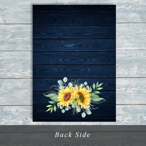 May include: A navy blue wooden background with a floral arrangement of sunflowers and greenery at the bottom. The text "Back Side" is printed in white at the bottom of the image.