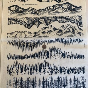 May include: A sheet of black and white transfer designs for crafting. The designs include various mountain ranges and forest scenes. The sheet is labelled "Ceramic Transfers" and includes the website "www.ceramictransfers.com".