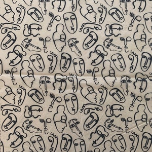 May include: A seamless pattern of black and white line drawings of abstract faces on a beige background.