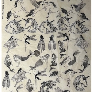 May include: A sheet of black and white transfer tattoos featuring mythical creatures. The sheet includes images of dragons, unicorns, mermaids, and fairies. The text "妖精  L104 00535740  图案设计  T恤"