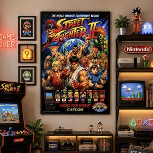 May include: A large vertical poster of Street Fighter II featuring multiple characters, the text THE WORLD WARRIOR TOURNAMENT BEGINS, CHOOSE YOUR FIGHTER, and CAPCOM. The poster is displayed on a wall next to a video game arcade cabinet.