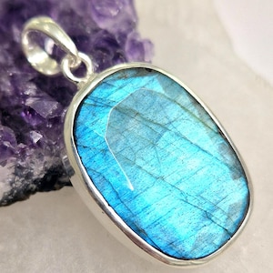 Artisan crafted blue faceted labradorite sterling silver pendant oval shape