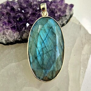 Artisan crafted blue faceted labradorite sterling silver pendant oval shape