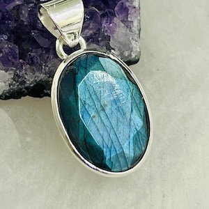 Artisan crafted blue faceted labradorite sterling silver pendant oval shape