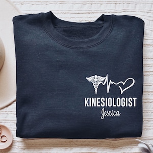 Personalized Kinesiologist shirt, long sleeve, sweatshirt, gift, custom name Kinesiology, physical therapist, therapy