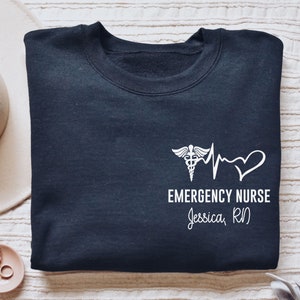 Personalized Emergency Nurse shirt, long sleeve, sweatshirt, tank top, hoodie, gift, pocket custom name heartbeat ER nurse