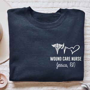 Personalized Wound Care Nurse shirt, long sleeve, sweatshirt, tank top, hoodie, gift, pocket custom name heartbeat Ostomy care nurse