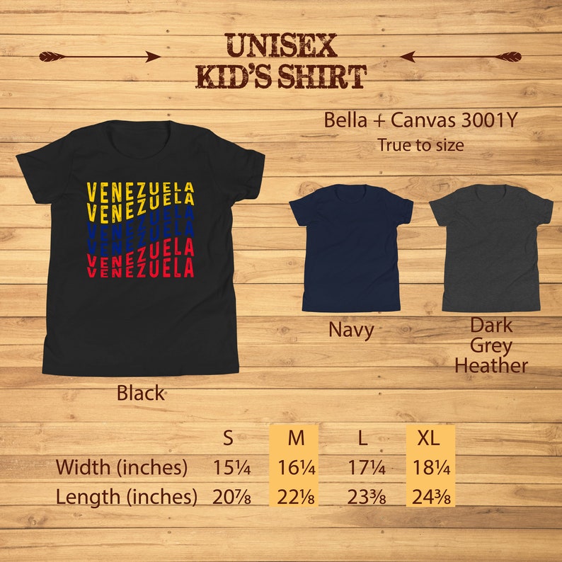 May include: Black unisex kid's shirt with the word "VENEZUELA" in yellow, blue, and red. The shirt is available in sizes S to XL, with a width of 15 1/4 to 18 1/4 inches and a length of 20 7/8 to 24 3/8 inches. Additional colors are navy and dark grey heather.