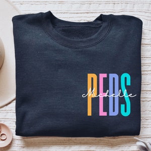 Personalized Peds shirt, long sleeve, sweatshirt, tank top, hoodie, gift, pocket custom name pediatrician, pediatric nurse, picu, peds