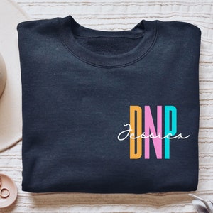 Personalized DNP shirt, long sleeve, sweatshirt, hoodie, gift, pocket Doctor of Nursing Practice, nursing doctorate