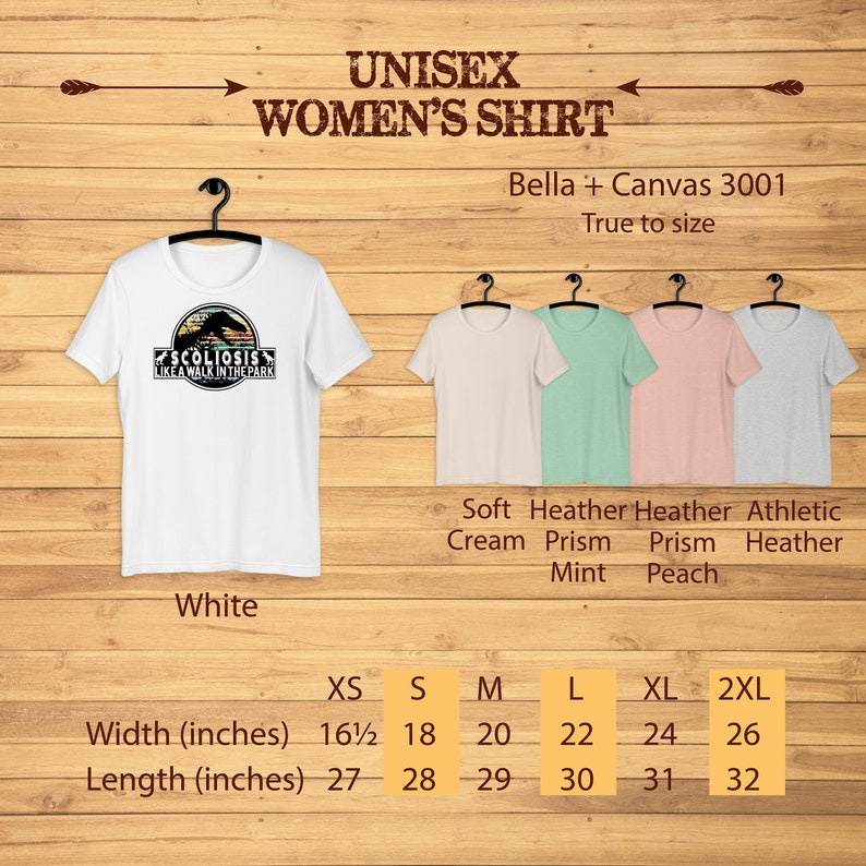 May include: White unisex t-shirt with a graphic of a dinosaur with the text "Scoliosis Like A Walk In The Park". The shirt is available in sizes XS to 2XL. The size chart shows the width and length of the shirt in inches.