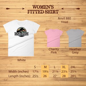 May include: White, pink, and grey fitted t-shirts with a graphic of a dinosaur with the text "Scoliosis Like A Walk In The Park". The size chart shows the width and length in inches for sizes S, M, L, XL, and 2XL.