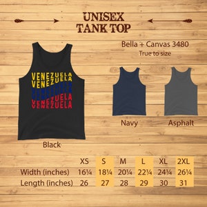 May include: Black unisex tank top with the word "VENEZUELA" stacked in yellow, blue, and red. Additional tank tops in navy and asphalt are displayed. Sizes range from XS to 2XL, with widths from 16 1/4 to 26 1/4 inches and lengths from 26 to 31 inches.