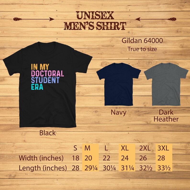 May include: Black, navy, and dark heather unisex t-shirt with the text "In My Doctoral Student Era" printed in rainbow colors. The shirt is available in sizes S-3XL. Gildan 64000. True to size.