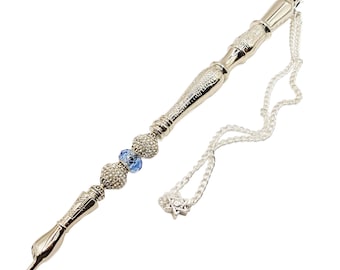 May include: A silver yad with a blue crystal bead and a silver chain with a Star of David charm.