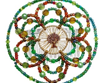 May include: A green, brown, and gold beaded hair comb with a tree of life design in the center.