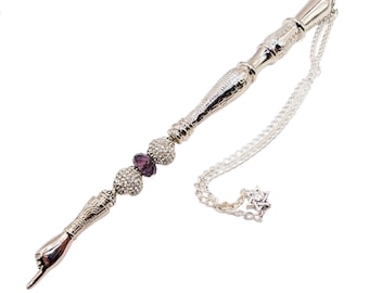 May include: Silver-toned metal yad with a hand-shaped handle, a chain with a star of David charm, and purple and clear crystal beads.