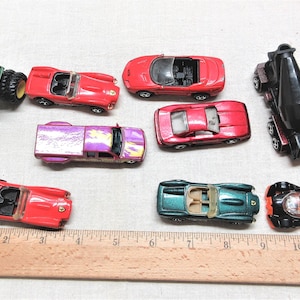 1990s Hot Wheels toy cars and a John Deere Tractor. Lot of 9 in good used condition