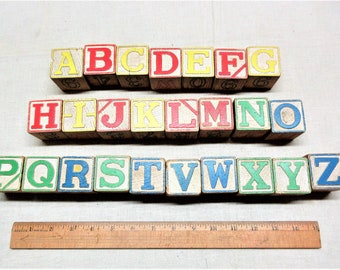 Vintage lot of wooden letter blocks, each has another letter on the opposite side. in good used condition.
