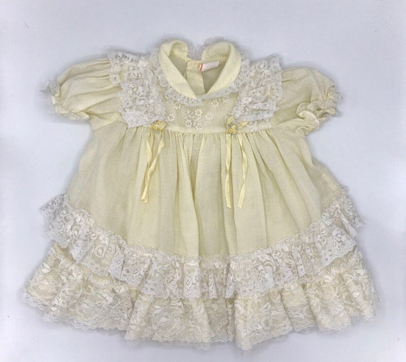 Vintage yellow smocked baby dress