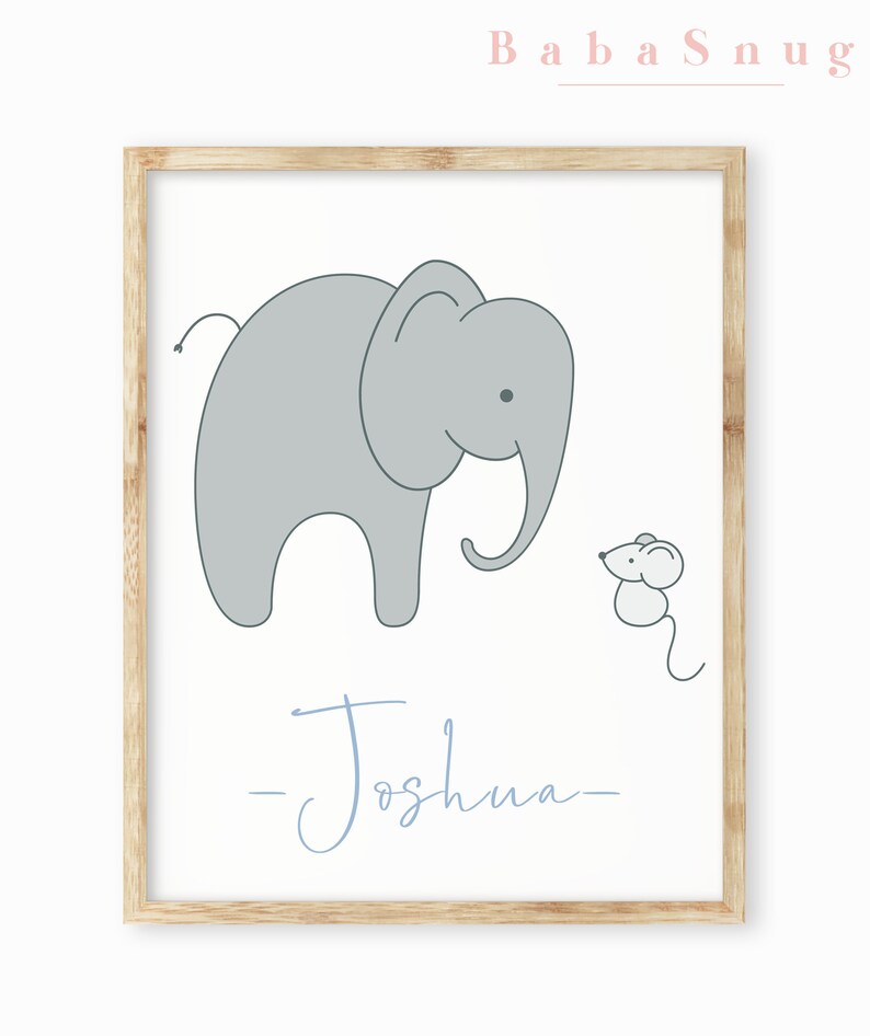 May include: A light blue framed print with a gray elephant and a small gray mouse. The text "Baba Snug" is in pink at the top of the print and the name "Joshua" is written in cursive at the bottom.